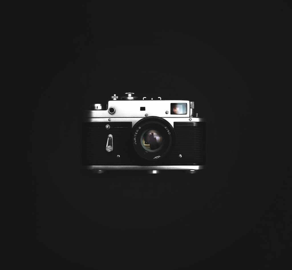 close up photograph of classic black and silver camera